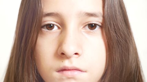 Young sad girl looks at the camera. 4k