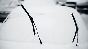 Windshield wipers lifted after heavy snowfall