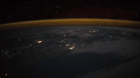 Outer space Earth view from the ISS as it passes above Africa Continent at night with the Aurora Borealis visible. Elements of this image furnished by NASA on Mac 14, 2017. Time lapse