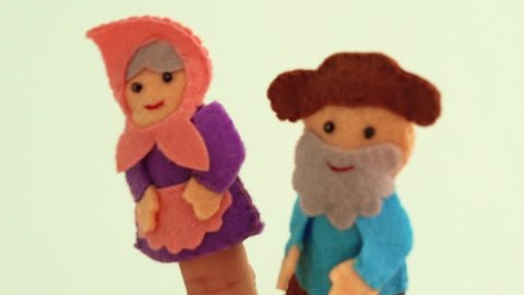 Dolls on the fingers of a man's hand. Different finger puppets for the puppet show. Performance at the kindergarten.
