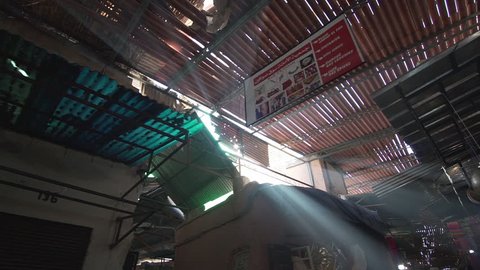 Flare and light rays in the souk of Marrakech Morocco where people sell typical and traditional home made commodities slow motion side