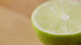 Closeup Shot Of Half Lime Rotating On Table