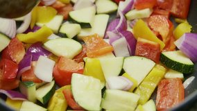 Closeup Of Vegetable Salad Is Sauted With Spoon In Saucepan