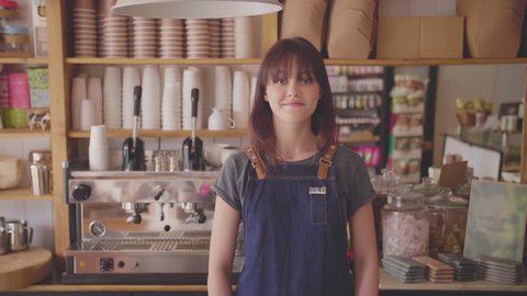 Smiling Small Business Owner Standing Arms Crossed In Coffee Store