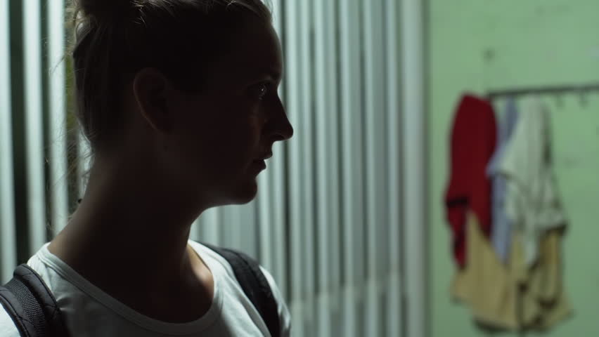 silhouette of young tourist female looking at camera nad smiling