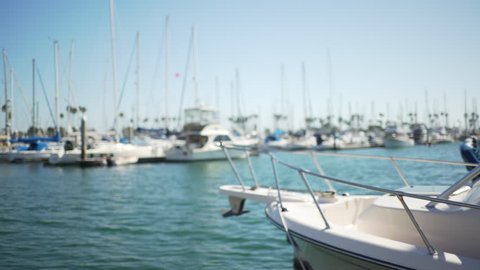 Open water in the marina with yachts floating in it for green screen or chroma key. Out of focus or defocused shot for compositing or keying.