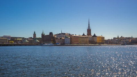 Timelapse video of Stockholm city skyline with sea and ferry in Sweden, time lapse 4K