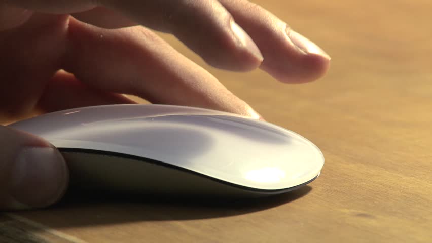 Static shot of a hand moving and clicking a mouse Royalty-Free Stock Footage #1008937595