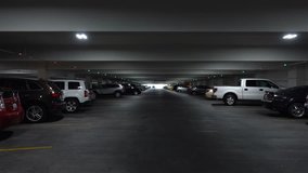 Professional video of POV drive through underground parking garage