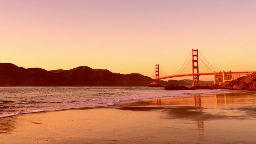 The Golden Gate Bridge as seen from Baker Beach at sunset, San Francisco, California, USA