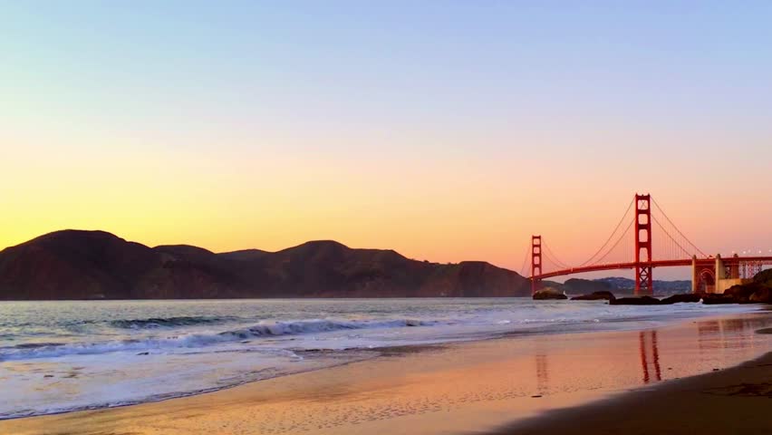 The Golden Gate Bridge as seen from Baker Beach at sunset, San Francisco, California, USA