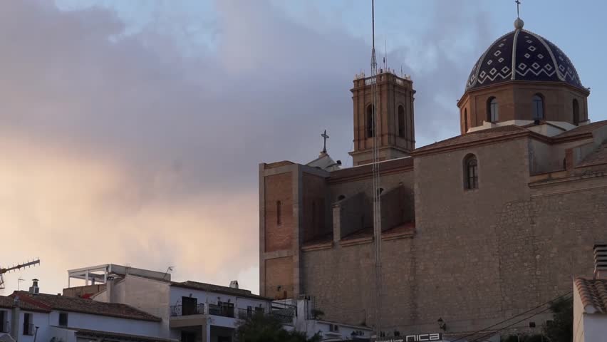 Timelapse of the old church in the old town of Altea Spain, clouds flowing in the background