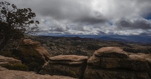 This is a three axis time lapse video filmed on Mt. Lemon, Arizona. High winds contribute to  rapid cloud movement over rock formations in the forground.