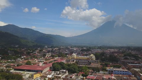 Drone aerial Guatemala Antigua city Central America Acatenango volcano of Agua. Antigua is a small city surrounded by volcanoes in southern Guatemala. It’s renowned for its Spanish colonial buildings.