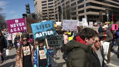 WASHINGTON, DC – MAR. 24, 2018:  Protesters arriving at massive March for Our Lives rally on Pennsylvania Ave. demanding government action on gun control and protesting politicians beholden to the NRA