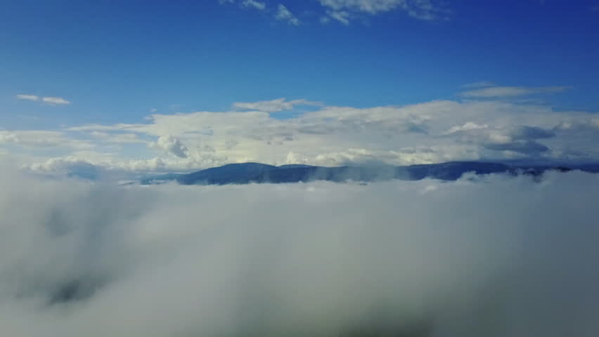 Flying drone in clouds  | Shutterstock HD Video #1008959495
