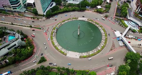 JAKARTA - Indonesia. March 14, 2018: Stunning aerial view of Hotel Indonesia roundabout from a drone flying from left to right. Shot in 4k resolution