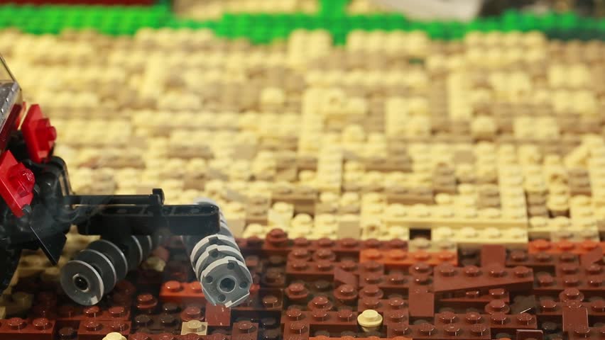 Slider tracking shot across a small tractor built from children