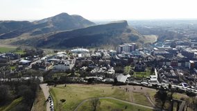 Aerial drone footage of City of Edinburgh, Scotland on a sunny day