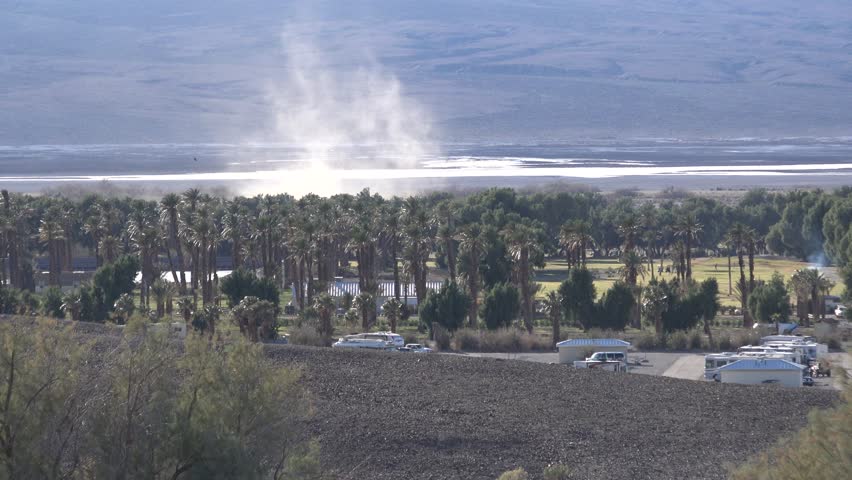 Campground views near Furnace Creek in Death Valley National Park. Campers in trailers, RVs, and motorhomes.