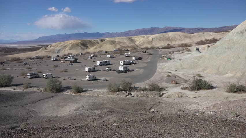 Campground views near Furnace Creek in Death Valley National Park. Campers in trailers, RVs, and motorhomes.
