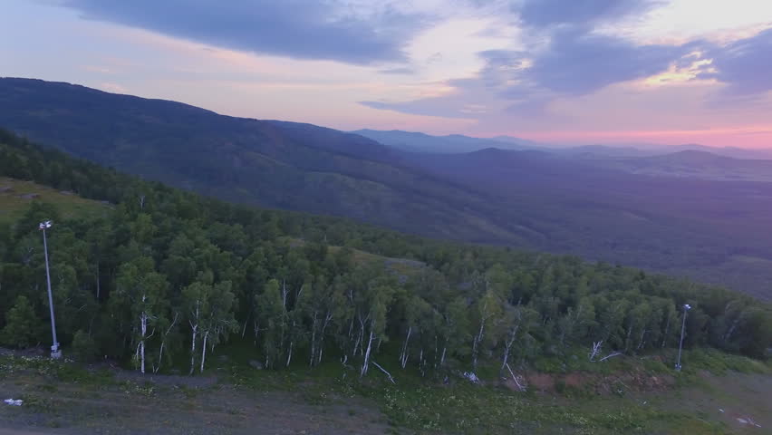 AERIAL: A colorful dawn on Lake Yakty-Kul, Bashkortostan. eautiful landscape of the valley, large lakes and a mountain chain on the horizon.