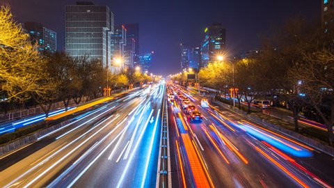 timelapse of busy traffic and modern building in beijing china