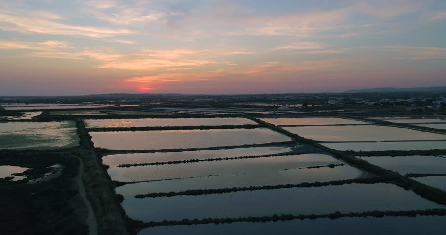 Sunset aerial seascape view of Olhao Marina, waterfront to Ria Formosa natural park. Algarve. Portugal.