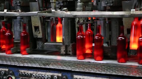 Production of glass bottles. Glass recycling. Bottle manufacturing industrial factory. Molten glass. Glass factory. Automated production line. Bottle manufacturing technology. Recycling. Ambient sound