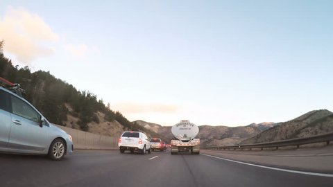 Denver, Colorado, USA-January 7, 2018-POV-Driving on Interstate highway I70 at sunrise.