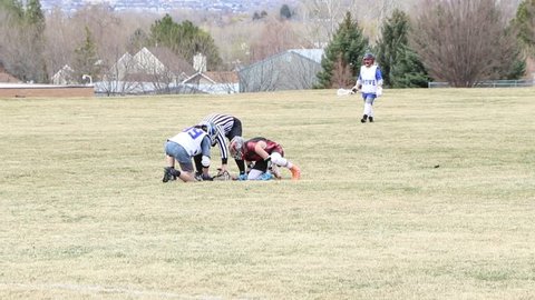 Lindon, Utah / United States - 03 24 2018: lacrosse game - youth lacrosse league in Utah. Match play as the goalie makes two saves.