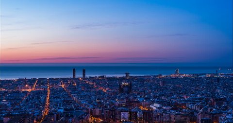 Barcelona Skyline from West to East Night to Day Time Lapse transition.