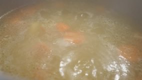 Slow motion liquid food mix close-up 1080p FullHD footage - Homemade boiling soup  in the pot 1920X1080 HD video