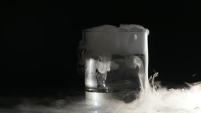 Abstract white smoke in glass the effect from dry ice on dark background