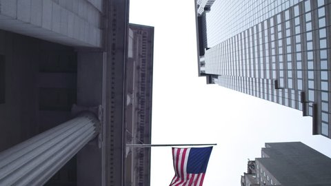 Symbols of the United States of America. State flag, the banking system. Financial district of New York City. Dolly shot .