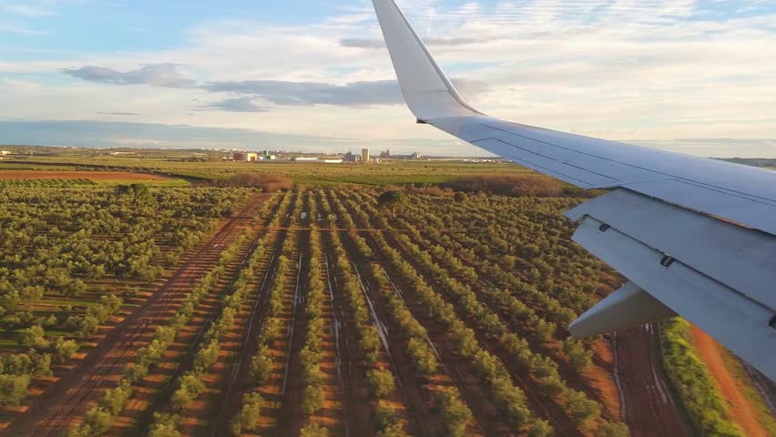 View of approach to seville airport as seen from window of seat of airplane passenger