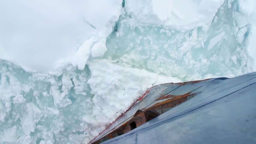 Bow of a ship going through pack ice in Antarctica.