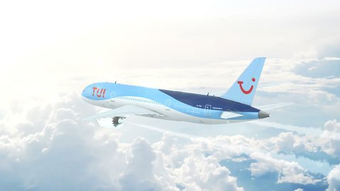 AMSTERDAM - MARCH 22, 2018: Aerial in-flight view of TUI Airways (Thomson Airways) Boeing 787 Dreamliner flying high above the clouds. 