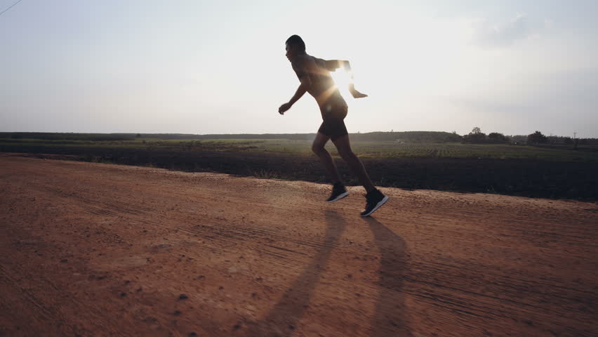 Young man runner at running for healthy.Running is an exercise as simple in order to make health of strong, Good health can not be traded,4k | Shutterstock HD Video #1009024337