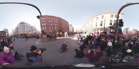 Denver, Colorado, USA-January 4, 2018-360 VR - The National Western Stock Show Kick-Off Parade with marching bands, floats, horseback riders, cowboys, cowgirls and  Longhorn cattle.