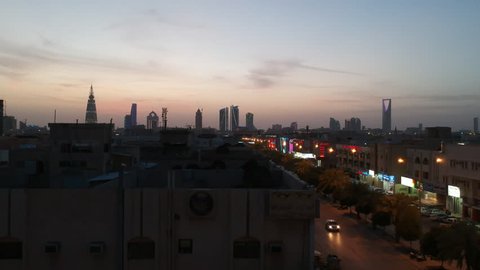 Riyadh, Saudi Arabia  - March 25, 2018: Aerial Drone Moving up to take shot of Riyadh Skyline over rooftops in a residential area