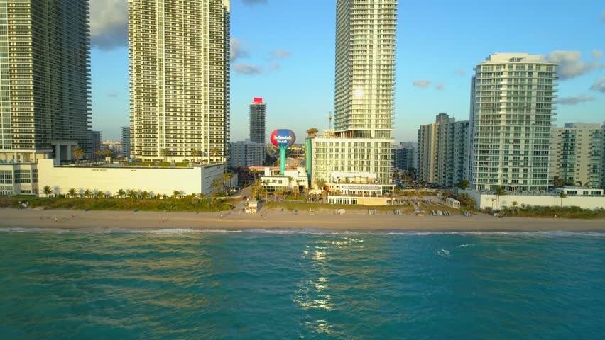 Aerial approach Hallandale Beach water tower closeup 4k