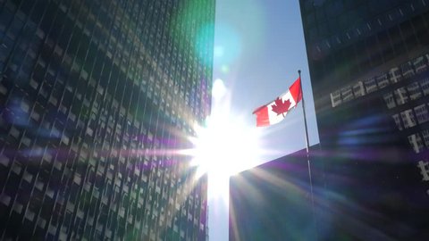 Tower with 2 tall downtown office buildings on sunny day with Canadian Flag