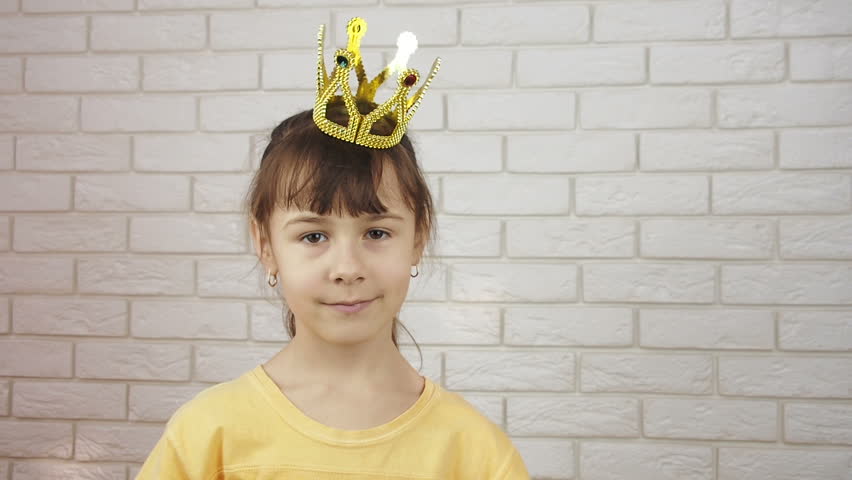 Funny princess. Little girl in the crown.