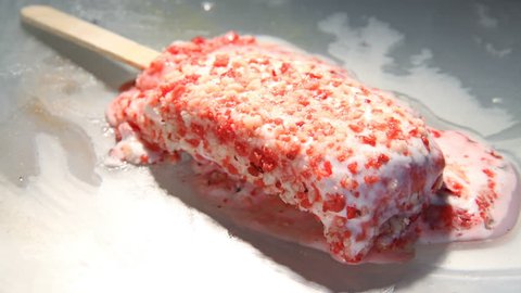 Time-Lapse of Strawberry Shortcake Ice Cream Popsicle melts (4k video)