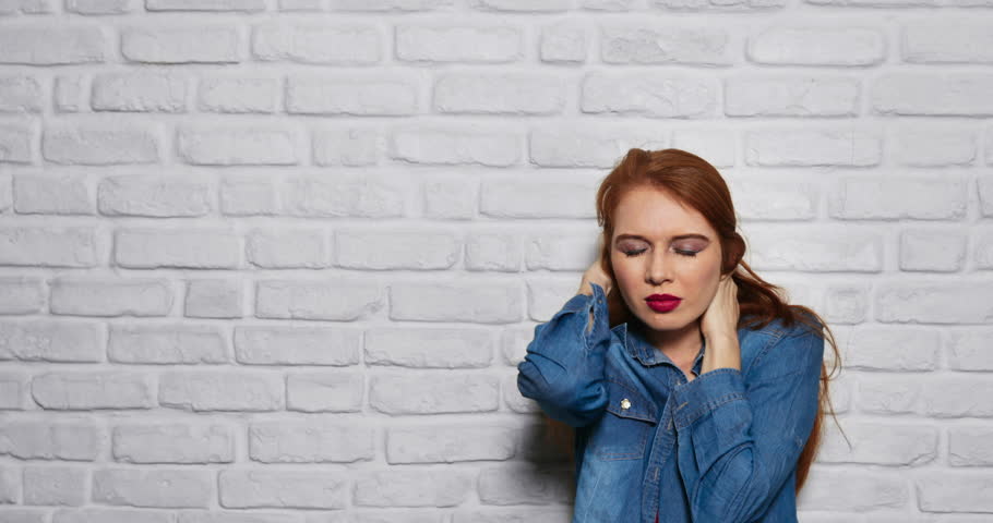 Portrait of worried woman. Redhead girl showing fear, terror and depression. Copy space, slow motion