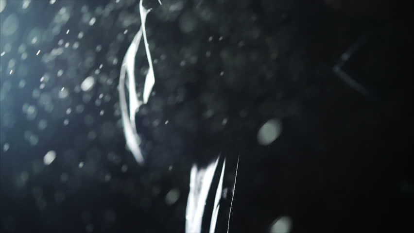man in raincoat under rain, close-up detail rain drops falling in slow motion Royalty-Free Stock Footage #1009041572