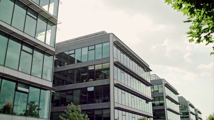 Modern glass building on a clear day.