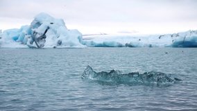Amazing view of large pieces of the iceberg. Location Atlantic ocean, Vatnajokull national park, Europe. Beautiful nature landscape. Discover the beauty of earth. Shooting in full HD 1080p video.