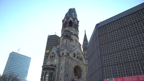 Berlin, Germany - March 9, 2018: Low angle of Kaiser Wilhelm Church and memorial to victims of Berlin attack